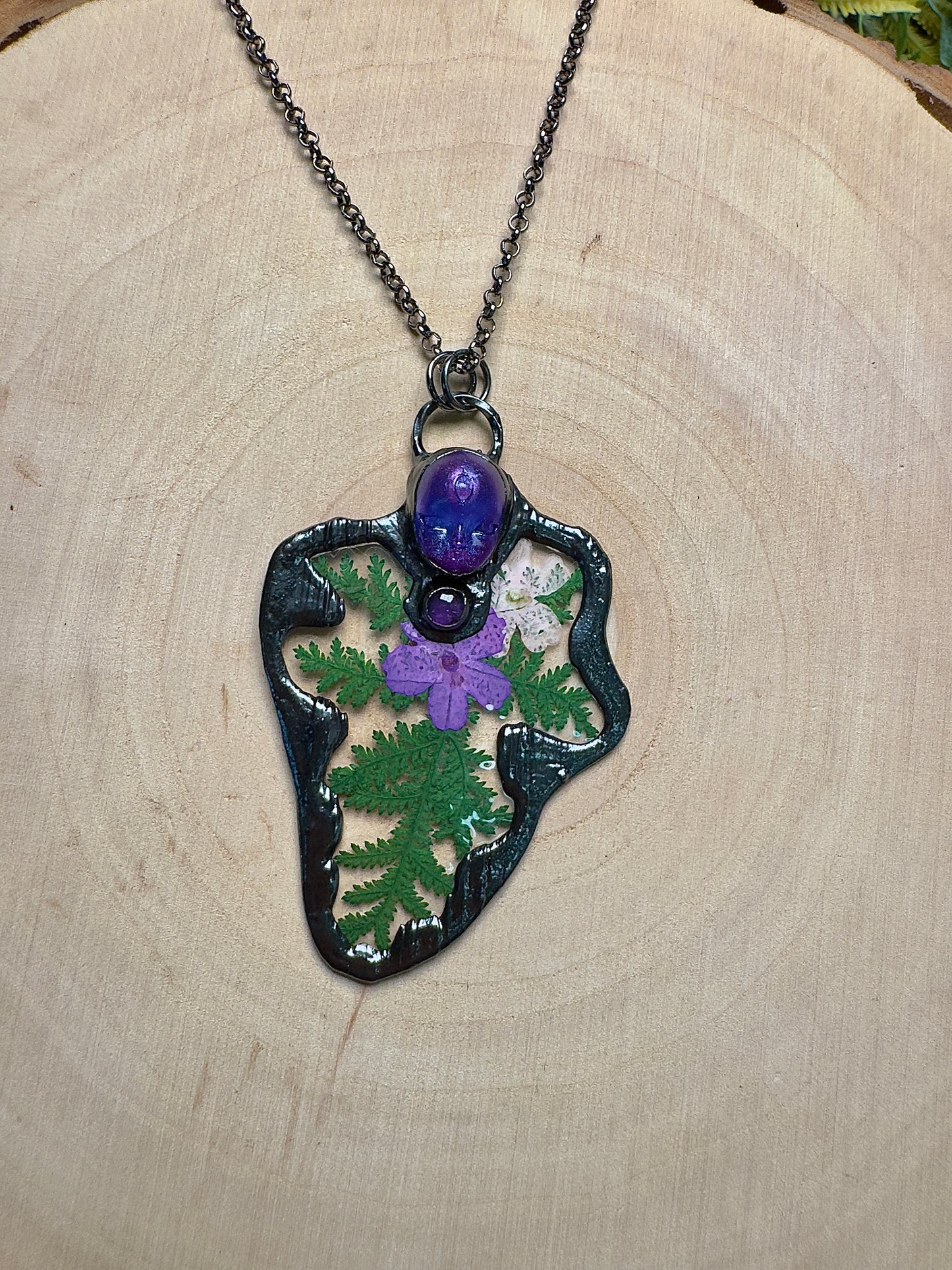 Enyalia- Resin Face, Amethyst, and Flower Necklace