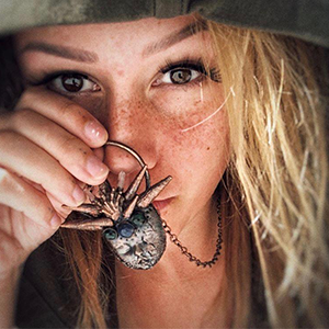 Artist, vlogger, wanderer, and youtuber modeling a Copper Ashes Original Lady of the Lake piece, The Sea Animal Whisperer.