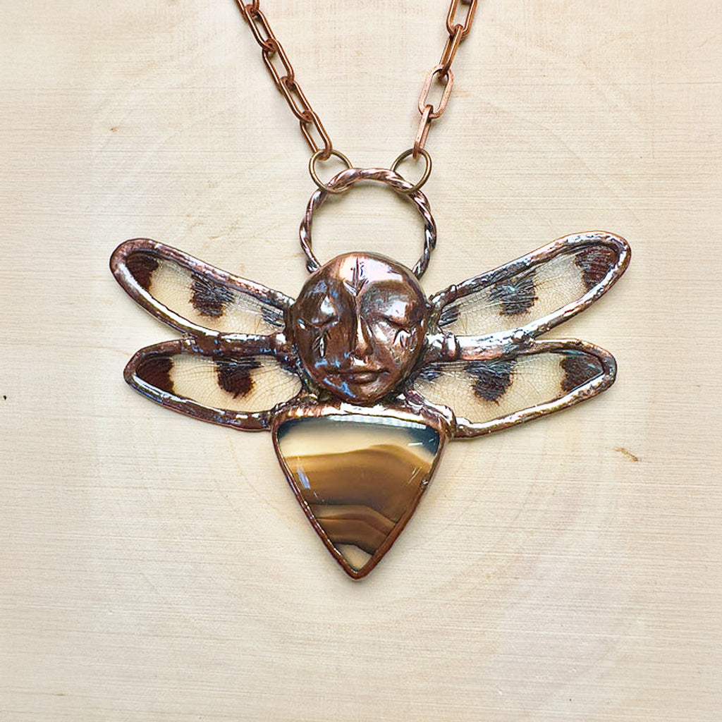 Pendant necklace made with copper, agate, and real ethically sourced dragonfly wings.
